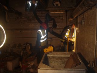 Generators and floodlights being assembled in basement area